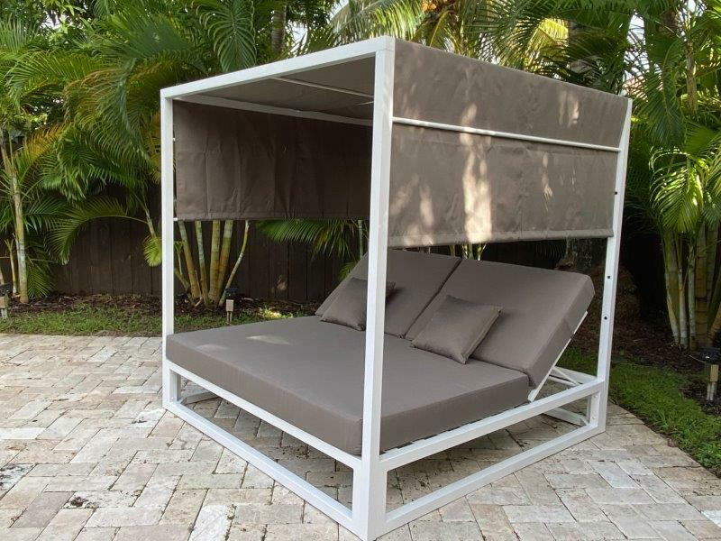 Ava outdoor gazebo bed on white brick patio