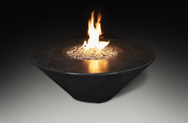 round fire pit table with flames lit