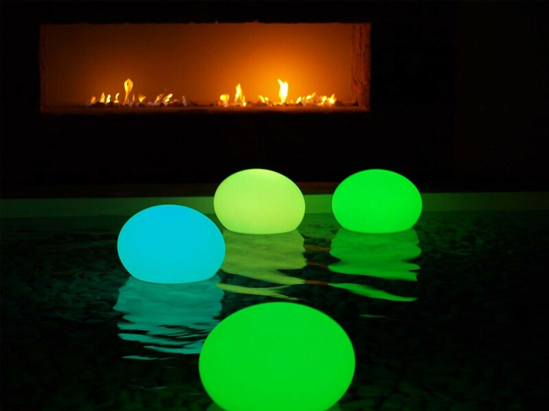 round, colorful LED lamps floating in wate